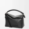 00d79e4693e5c67b6729ca5b3eb76f70-scaled-1.webp Puzzle bag in classic calfskin