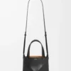 04eac0fd2318667311306555cec57145-scaled-1.webp Mini Puzzle Fold tote in shiny calfskin