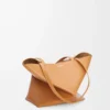 0cca412f43fce6c905b5ed6e5cd1b073-scaled-1.webp Medium Puzzle Fold tote in shiny calfskin