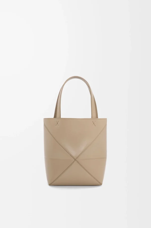 2a525e96f2e0a7acdb0efee16ea48976-scaled-1.webp Mini Puzzle Fold tote in shiny calfskin