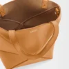 37ad7082aa0a0eaf57403c0db83e304f-scaled-1.webp Mini Puzzle Fold tote in shiny calfskin