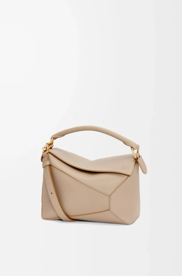 424cfe34b51c115882d8b94d319638ce-scaled-1.webp Small Puzzle bag in soft grained calfskin