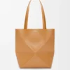 46cde76e5ac322d6b95dd6c3cc003701-scaled-1.webp Medium Puzzle Fold tote in shiny calfskin