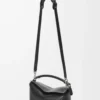 4b7b1163bc19df3cc0cbced445a111ab-scaled-1.webp Puzzle bag in classic calfskin