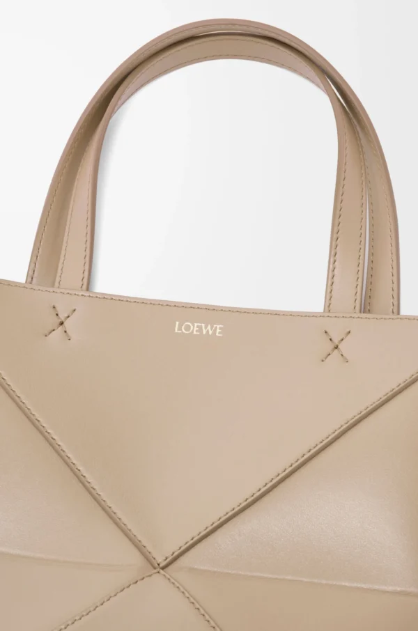 60c75f94bec186395e1981cc1cbfdaa4-scaled-1.webp Mini Puzzle Fold tote in shiny calfskin