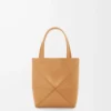 6265d3dc15b512c302c66306b74694fb-scaled-1.webp Mini Puzzle Fold tote in shiny calfskin