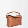 67c98e39c9dc684b7c8d87c2a5f68cba-scaled-1.webp Small Puzzle Edge bag in classic calfskin