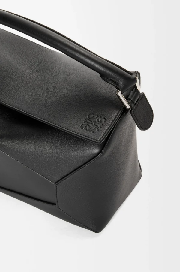 697395c3997b8f0e9c0384895e54a970-scaled-1.webp Puzzle bag in classic calfskin