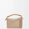 6e07a11ddc15eda86ec7b37b1b1f8ea0-scaled-1.webp Small Puzzle bag in soft grained calfskin