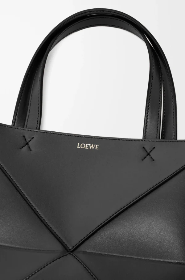 74c7d67f31edce3f8a843cb7734d500e-scaled-1.webp Mini Puzzle Fold tote in shiny calfskin
