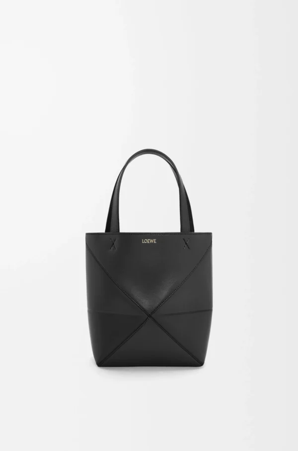74f024e6f41d57212f1848c62b525eea-scaled-1.webp Mini Puzzle Fold tote in shiny calfskin