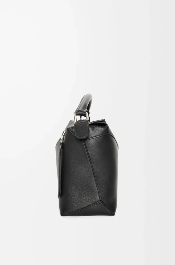 7a31bc439a18989f8878318fa8f5f3dd-1-scaled-1.webp Puzzle bag in classic calfskin