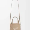 7a714e6268eee9f876ff6dd27779129b-scaled-1.webp Mini Puzzle Fold tote in shiny calfskin