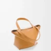 7d954bf0940eb954f262e9097da59817-scaled-1.webp Mini Puzzle Fold tote in shiny calfskin