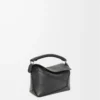 7ea4013c69d50fc2c100bcfcbf2f0f8c-scaled-1.webp Mini Puzzle Edge bag in classic calfskin