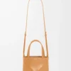 844f4cbe03ce67c386675902d4b518ce-scaled-1.webp Mini Puzzle Fold tote in shiny calfskin