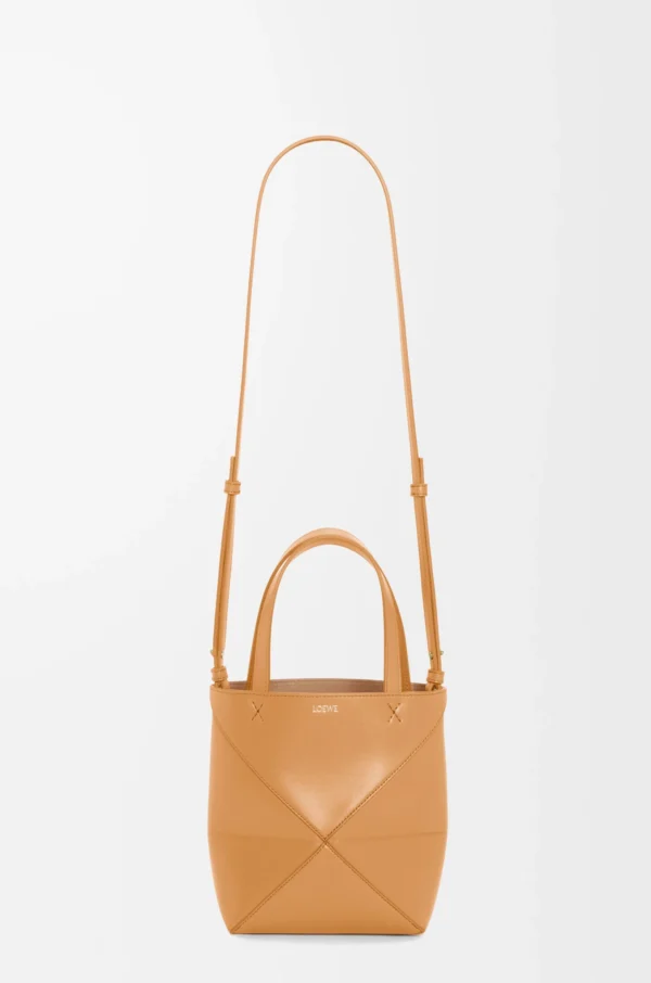 844f4cbe03ce67c386675902d4b518ce-scaled-1.webp Mini Puzzle Fold tote in shiny calfskin