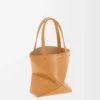 8f9b9024335181e653665ef242ae3719-scaled-1.webp Mini Puzzle Fold tote in shiny calfskin