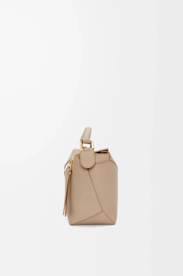 9229b5fb8a44dd7c4a34c6598b84b993-scaled-1.webp Small Puzzle bag in soft grained calfskin