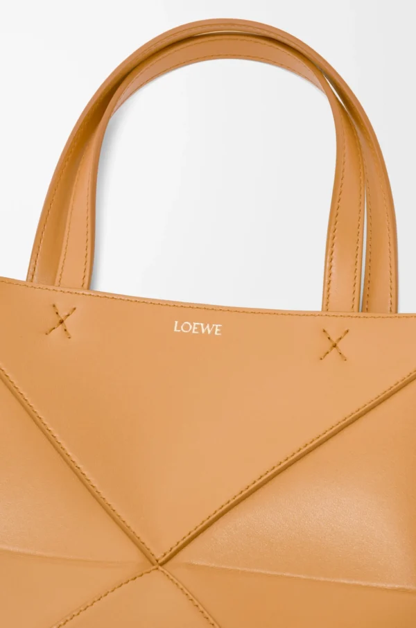 92db28efe64b00d86723b7e67b2efe16-scaled-1.webp Mini Puzzle Fold tote in shiny calfskin