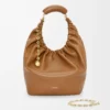 96aa6ebda349ff2b71e457b54f216975-scaled-1.webp Medium Squeeze bag in mellow nappa lambskin