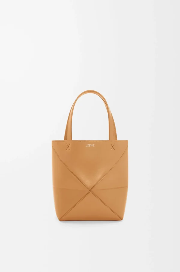 98a7da617a83a8a262b2b020f2533621-scaled-1.webp Mini Puzzle Fold tote in shiny calfskin