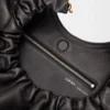 9b0cc2e118915d63addea0aae43a73e3-scaled-1.webp Medium Squeeze bag in mellow nappa lambskin
