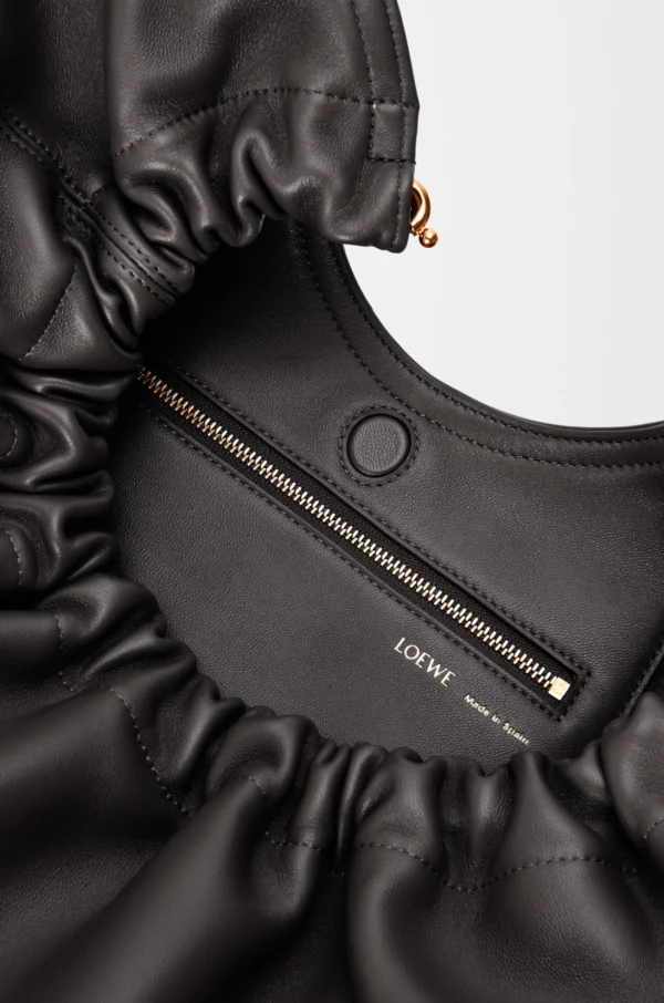 9b0cc2e118915d63addea0aae43a73e3-scaled-1.webp Medium Squeeze bag in mellow nappa lambskin