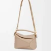 9e77b753957fcb104aee78709dcf2424-scaled-1.webp Small Puzzle bag in soft grained calfskin