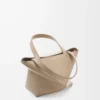 a0f445a79fc22ff78e22ca86a0600cf0-scaled-1.webp Mini Puzzle Fold tote in shiny calfskin