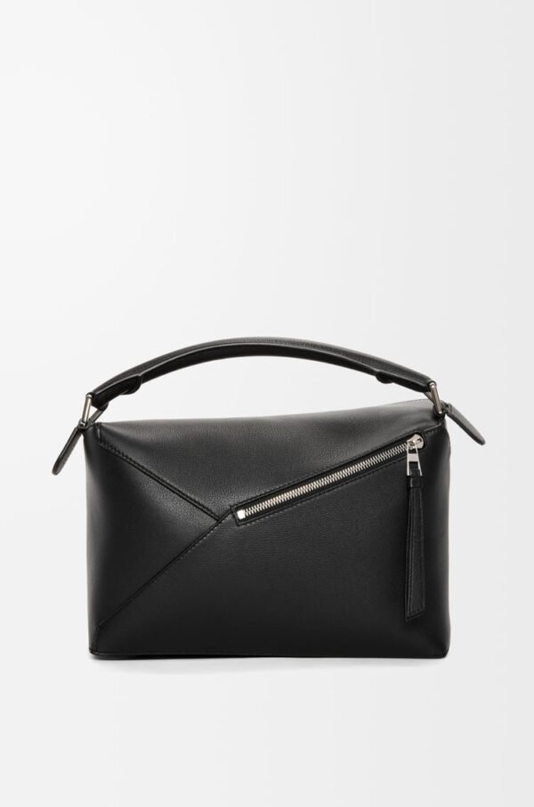 a500ee8257d5538f6fa7fb42029544c8.jpg Puzzle bag in classic calfskin