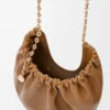 a9eb575e815ce4d130da5b8152d699f8-scaled-1.webp Medium Squeeze bag in mellow nappa lambskin