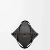 a9feb89f96528034451fdaa03d786629-scaled-1.webp Mini Puzzle Fold tote in shiny calfskin