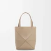 aed2ec354fa58f0637ce2abb416bd5dd-scaled-1.webp Mini Puzzle Fold tote in shiny calfskin