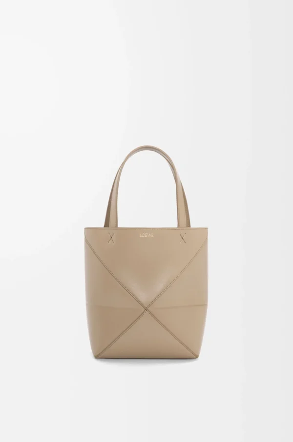 aed2ec354fa58f0637ce2abb416bd5dd-scaled-1.webp Mini Puzzle Fold tote in shiny calfskin