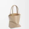 b8abee123f715ec727157cd49f2bbe2f-scaled-1.webp Mini Puzzle Fold tote in shiny calfskin