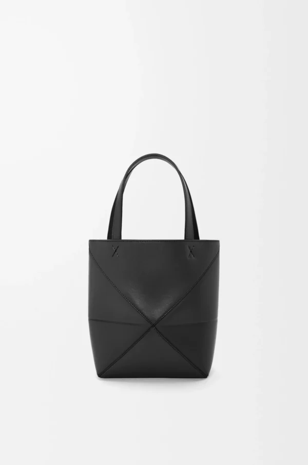 c01f0a277bbcdfa80e8ee072f1dae4ad-scaled-1.webp Mini Puzzle Fold tote in shiny calfskin