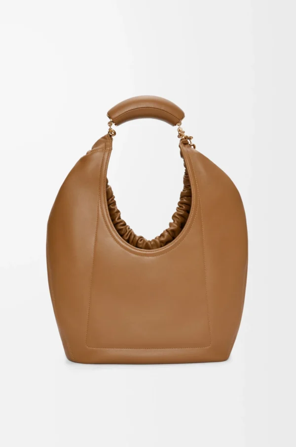 cf6e7c79208f16dead273595c3637f65-scaled-1.webp Medium Squeeze bag in mellow nappa lambskin