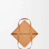 f03a0b30c5ee4235285c741f2df73b35-scaled-1.webp Medium Puzzle Fold tote in shiny calfskin