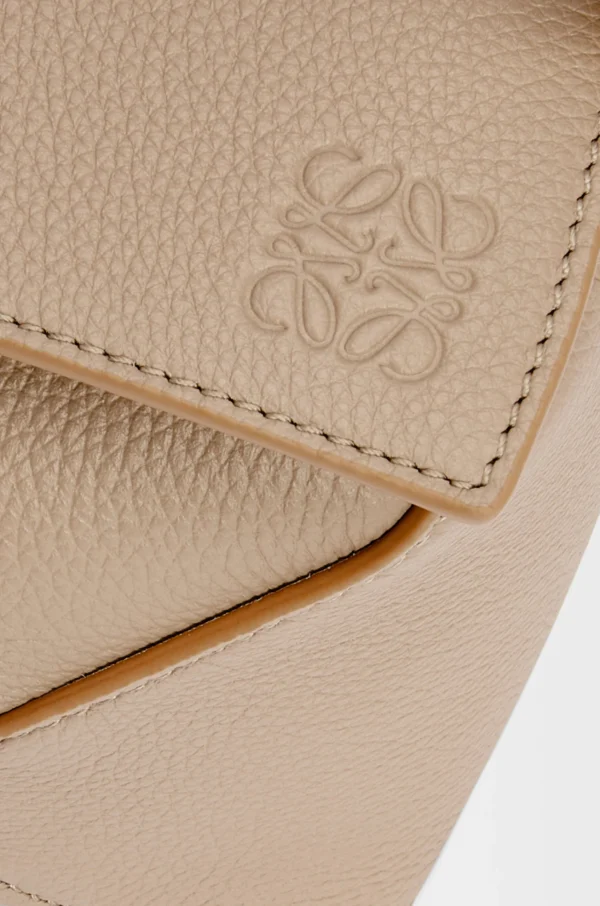 f33e7bf654c5ba1472e3cb999429efb5-scaled-1.webp Small Puzzle bag in soft grained calfskin