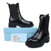 Prada Monolith patent leather booties black